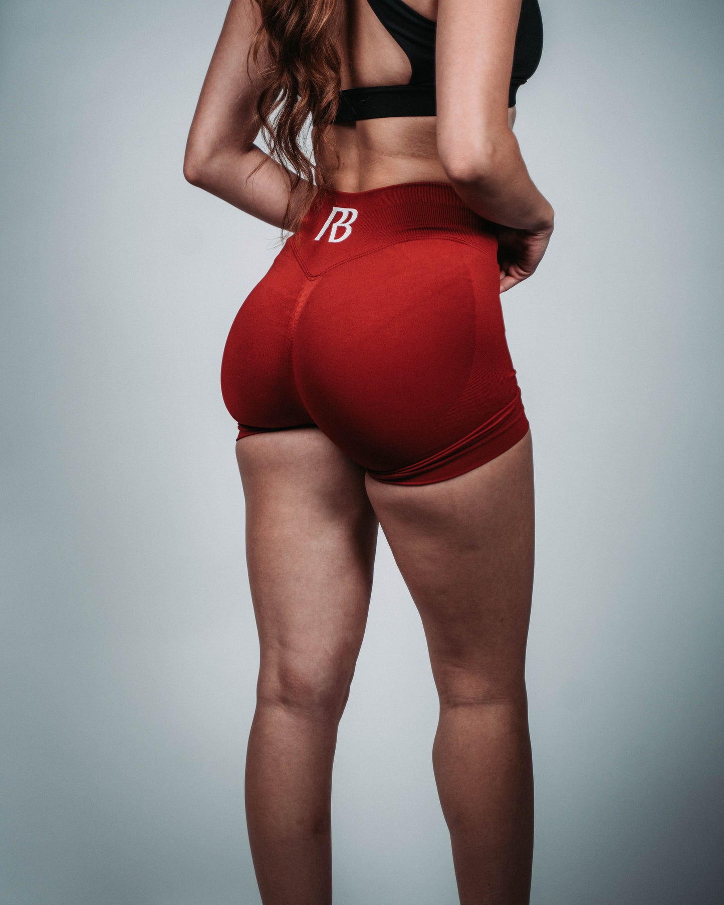 Red athletic shorts with a logo