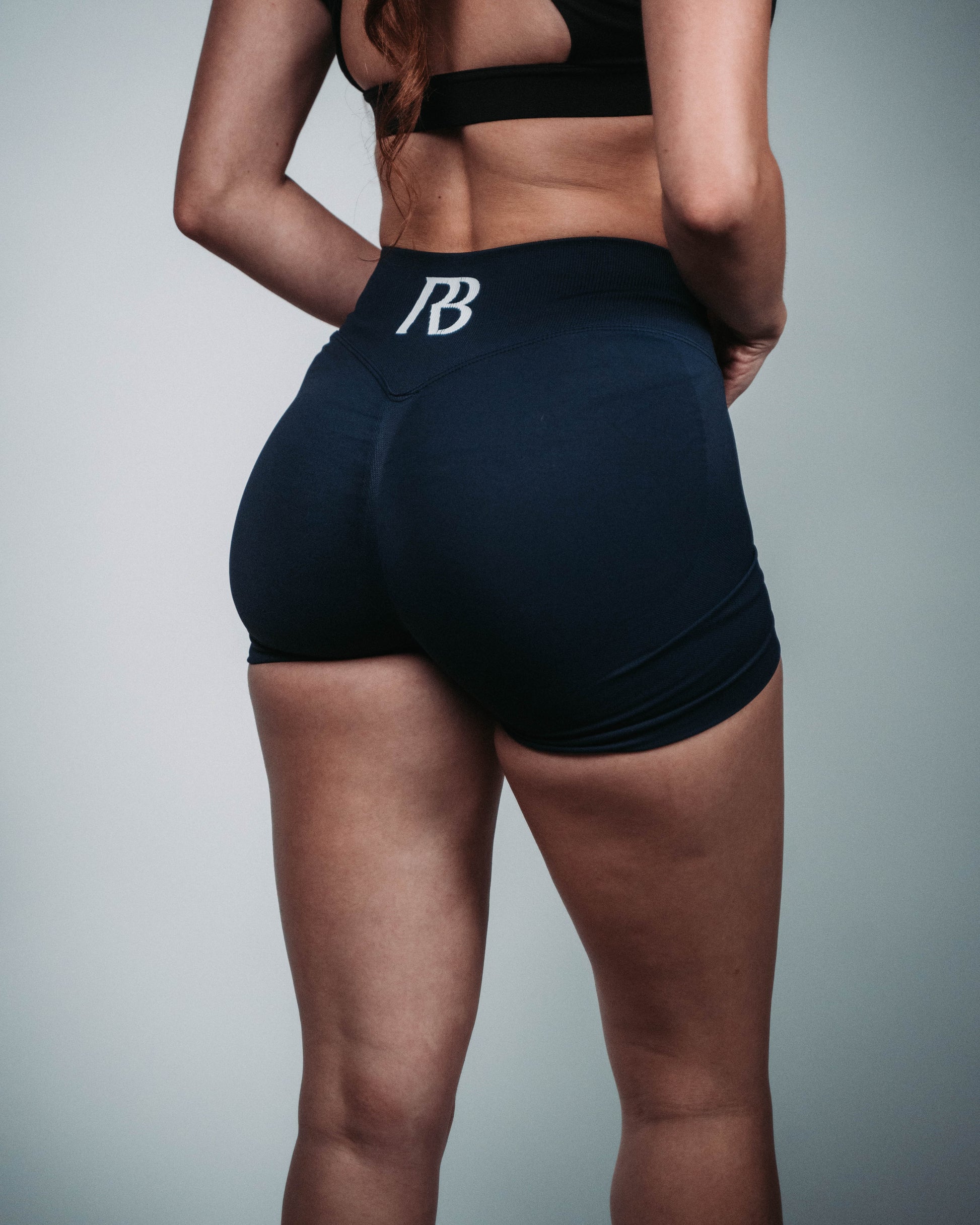black athletic shorts with a logo